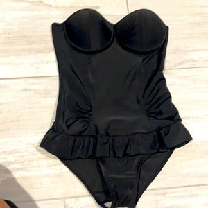 Worn once. Push up one piece Fits more like a S